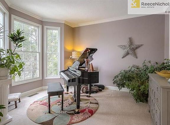 Peaceful study has wonderful natural light and new paint color.