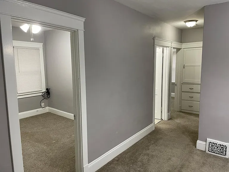 Hallway looking into 1st Bedroom, bathroom, 2nd Bedroom and Linen Cabinet