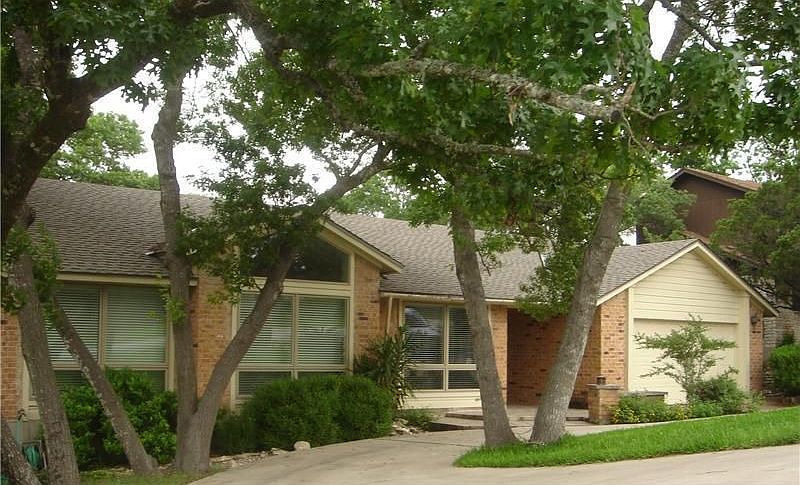 Beautiful front yard with lots of mature trees