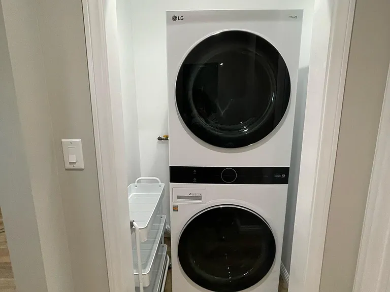 New LG Wash Tower. Dryer on top washer on bottom. Laundry cart for convenience and to store laundry essentials.
