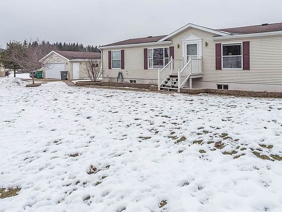 2.5 Car Garage and 4  Car Pole Shed