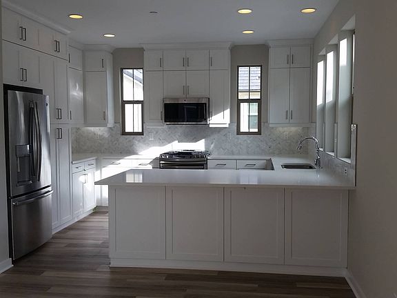 Homesite 54 has a bright white farmhouse kitchen