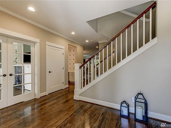 The home greets you with a large entry foyer, and gleaming hardwoods throughout the main level.