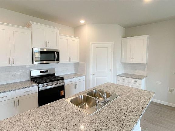 Kitchen - All Home and community information, including pricing, included features, terms, availability and amenities, are subject to change at any time without notice or obligation. All Drawings, pictures, photographs, video, square footages, floor plans, elevations, features, colors and sizes are approximate for illustration purposes only and will vary from the homes as built.