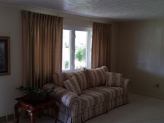 Ceramic tile entry into this bright and neutral colors and crown molding.