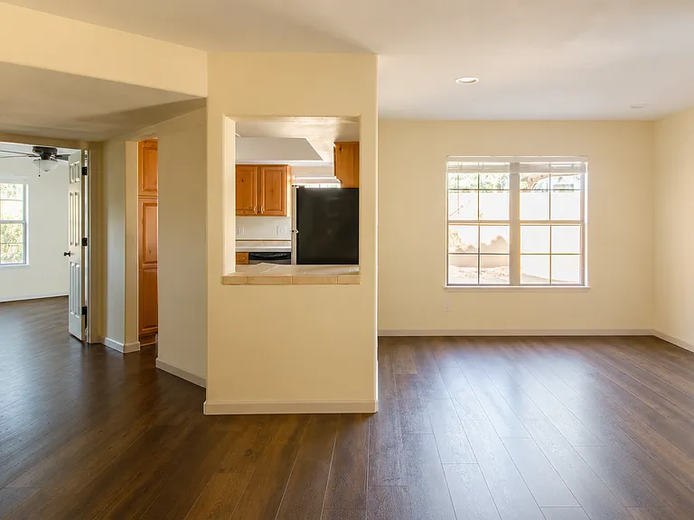 Open concept with views from the living room of the kitchen and dining area on the right.