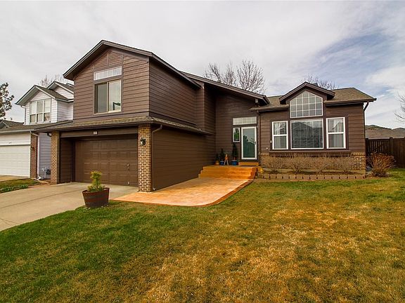 Front of home with stamped concrete front porch.