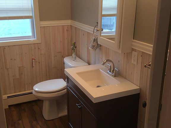 Newly Renovated Bathroom with Tile Flooring and Subway Tile