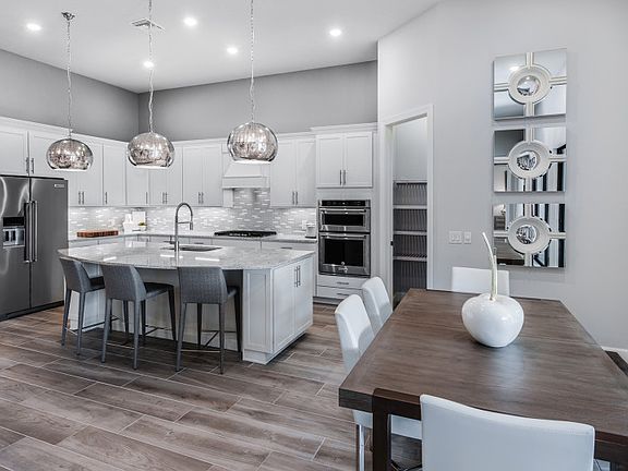 Model Representation Cafe dining space ideally located off of the kitchen, also with sliding glass