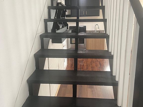 Open floor concept, stairs lead to loft