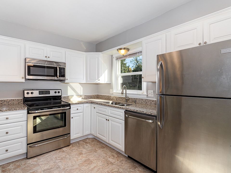 Beautiful kitchen with granite, stainless appliances and window over looking the backyard