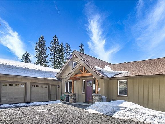 Wood detail and stone entry way shows great craftmanship and character.