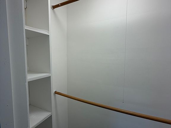 one of two closets in master bedroom