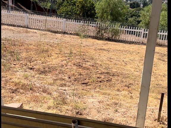 Large backyard with a view and an amazing breeze.