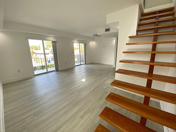 Living/Dining Area with Balcony Access