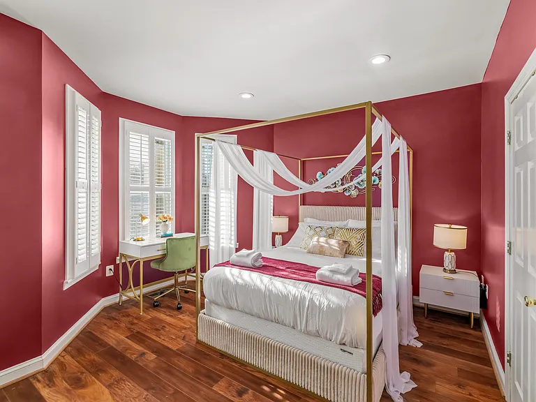 Master Bedroom with a Queen Canopy Bed, desk and chair