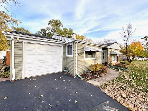 1 car attached garage with driveway that will accommodate 2 extra cars.
