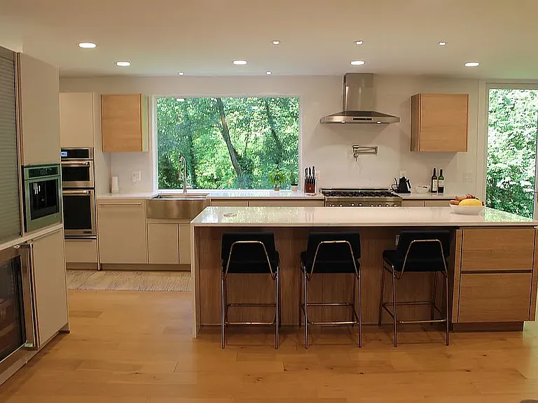 Modern European style kitchen with custom German cabinets. Built-in coffee maker and drink fridge. Incredible views.