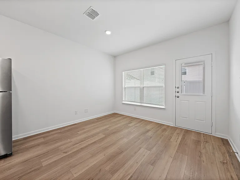 Dining room with a large window.