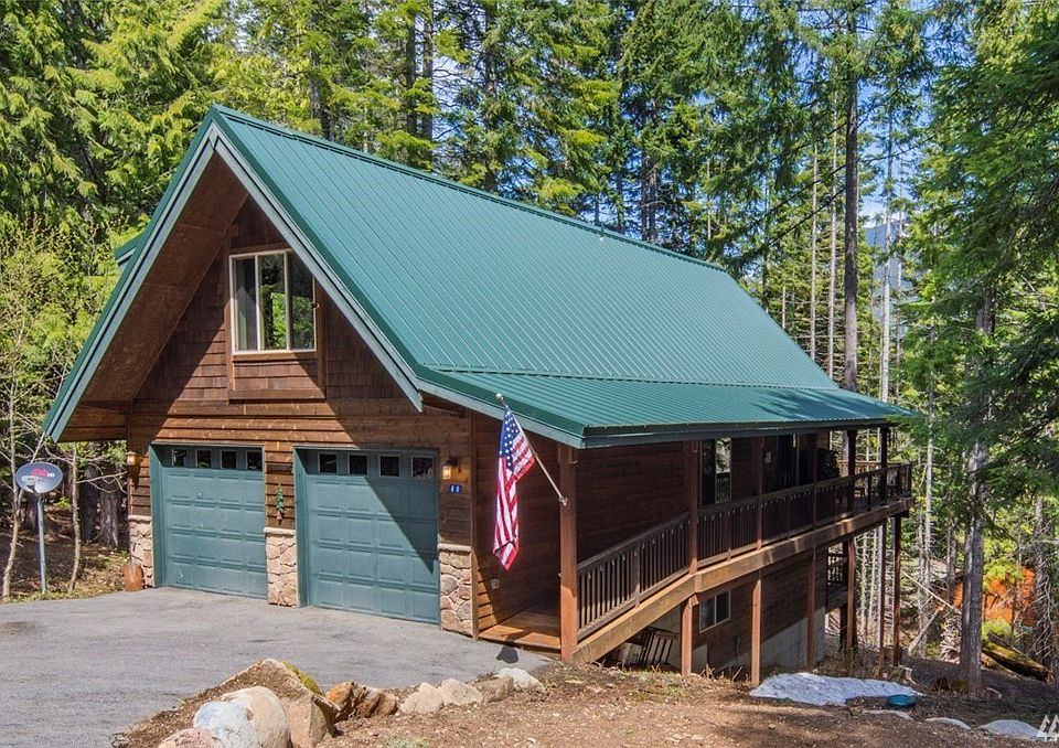 Paved driveway! Check out the covered walkway to the front door too- nice for winter!