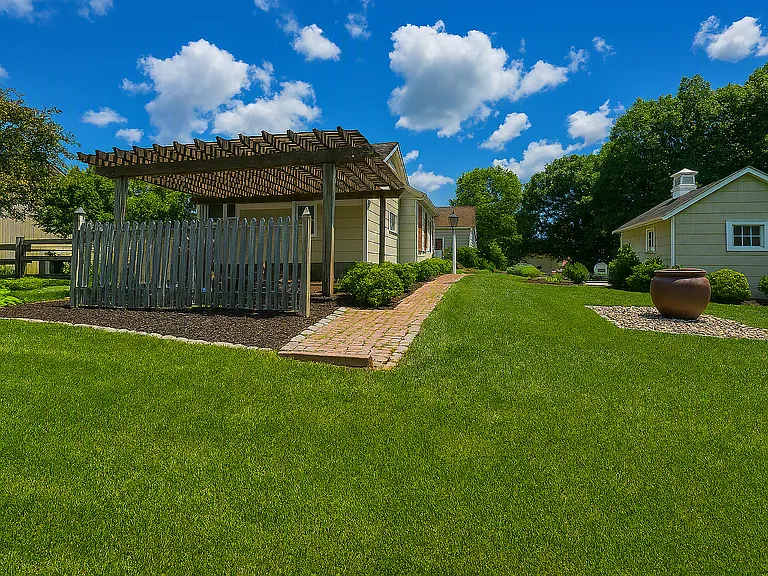 Backyard and 1 car garage to the right