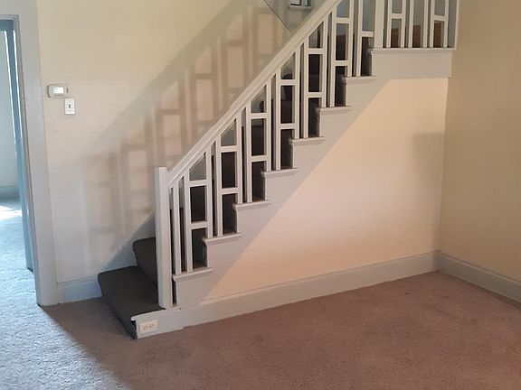 Beautiful, two-stage staircase open to living room and hallway.