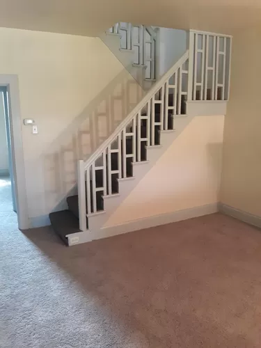 Beautiful, two-stage staircase open to living room and hallway. - 3856 Nantasket St