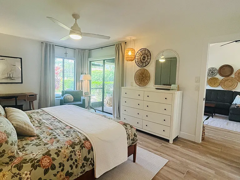 Patio doors in the primary bedroom lead out to the lanai as well. Mature landscaping lines the back of the home, offering beautiful added privacy.