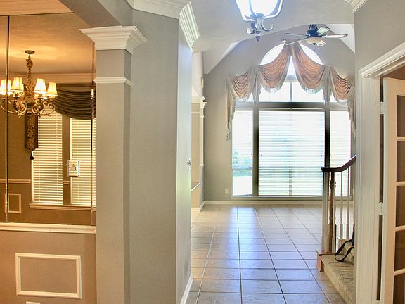 front entry, right hand side study with french doors, left hand side formal dinning
