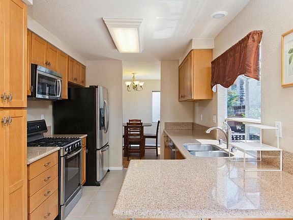 Kitchen with new stove and dishwasher