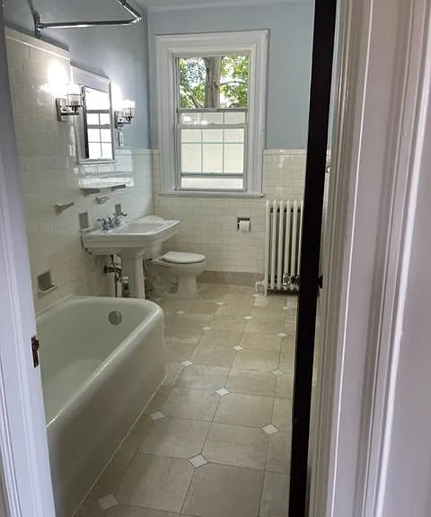 Bathroom with deep antique tub.