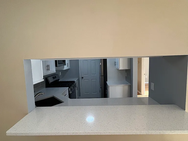 Breakfast Bar in Dining Area looking into Kitchen