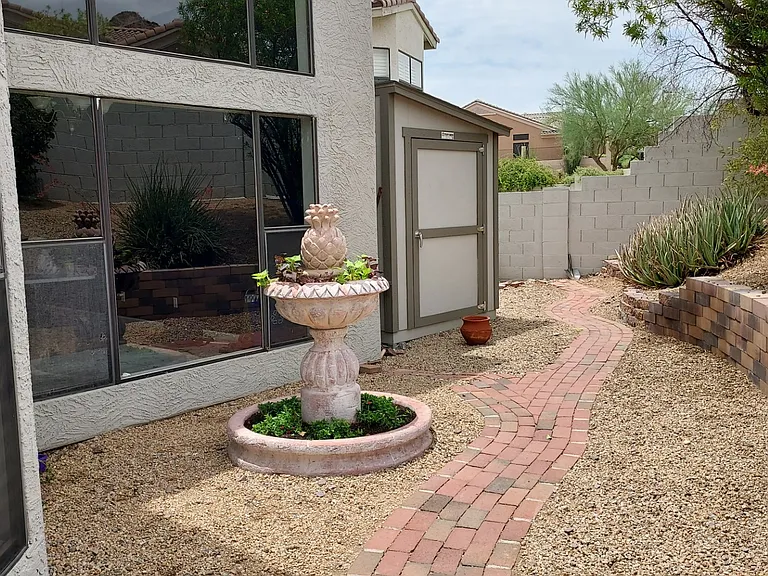 Backyard, garden, and lot of greenery with a tough shed