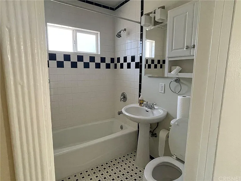Bathroom with restored vintage tiles