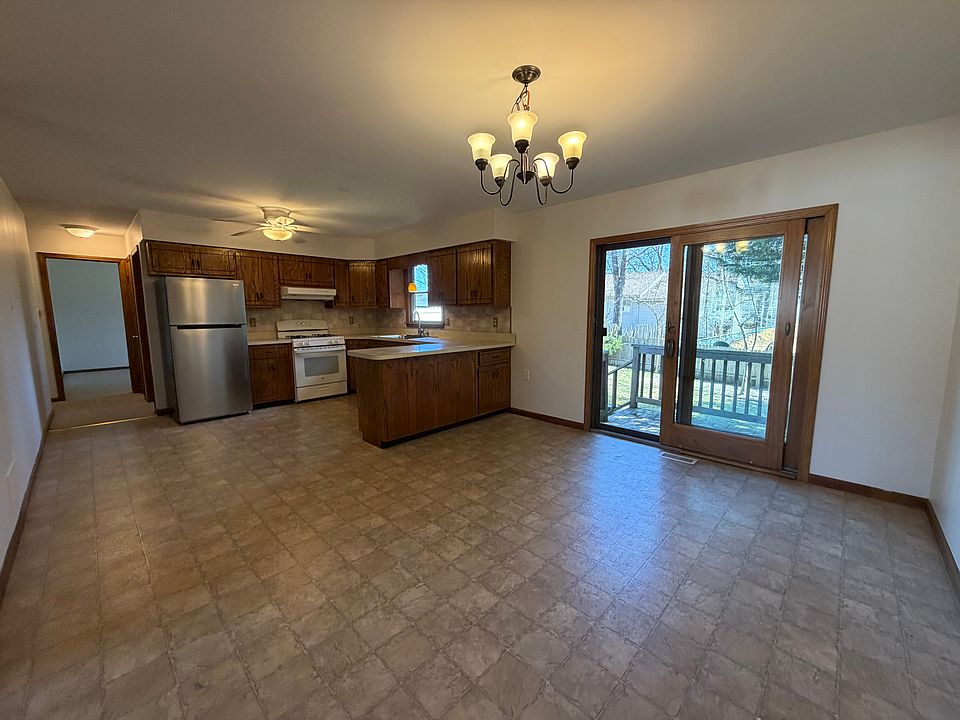 Dining room, Kitchen and sliders to deck and fenced in yard.