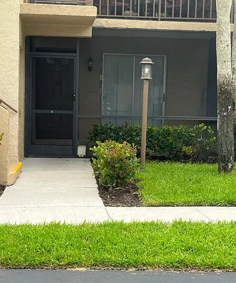 Entrance on ground floor with screened patio.