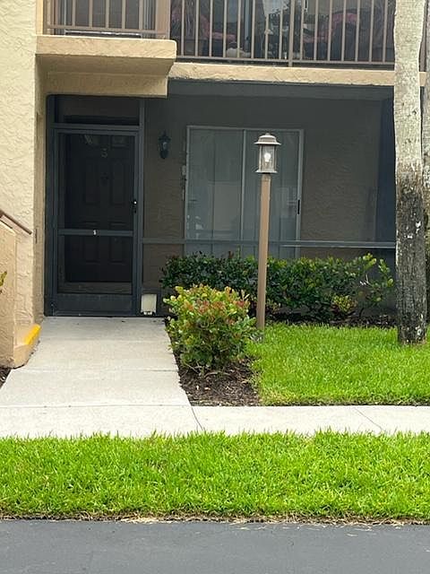 Entrance on ground floor with screened patio.