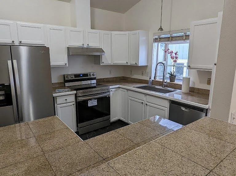 Completely updated kitchen with brand new appliances, new floor and cabinets