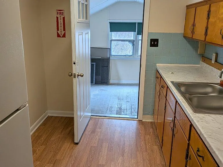 Kitchen / Exit to enclosed porch