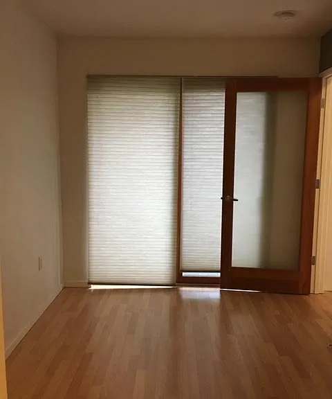 Den with sliding door patio