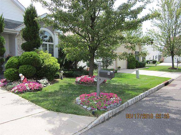 Exterior of Home Boasts Beautiful Flower Beds!