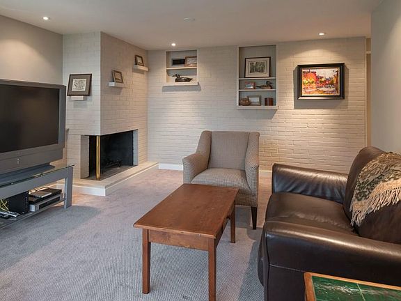Note; We have updated furniture (not shown in these pics). All carpet recently removed and replaced with engineered hardwood floors. MIL Living room has brick wall and wood burning fireplace.