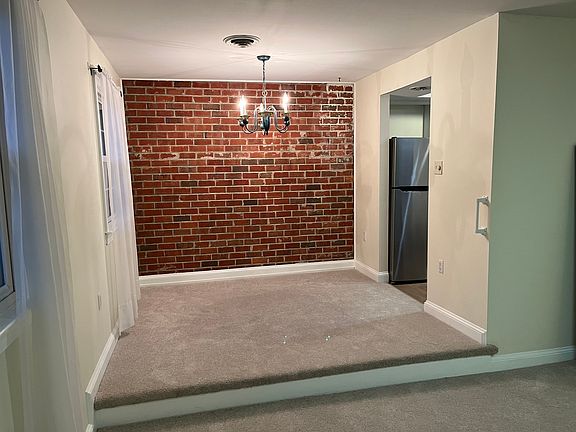 Standing in living room and looking into the dining room area. Doorway goes into kitchen.