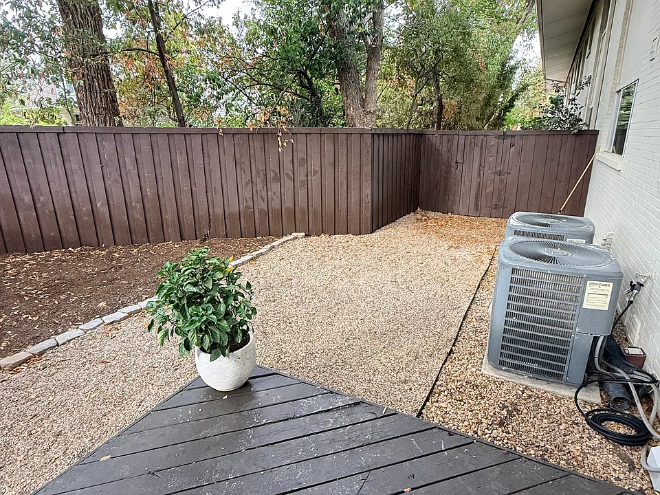 Largest backyard in the complex with a gate taking your parking spots and the dumpster.