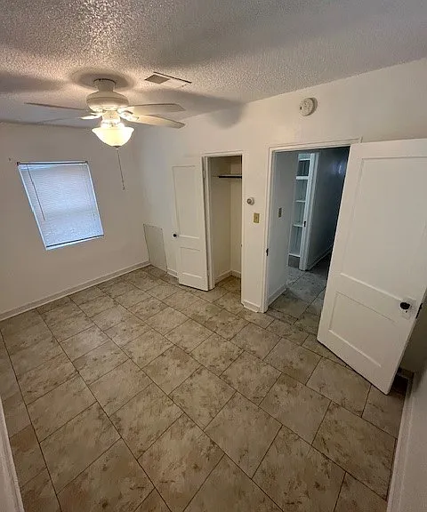 Main Bedroom fitted with:
Ceiling fan/light combo.
A newer window air conditioner unit (installed seasonally by Landlord).
Built-in closet.
Large windows with plenty of light.