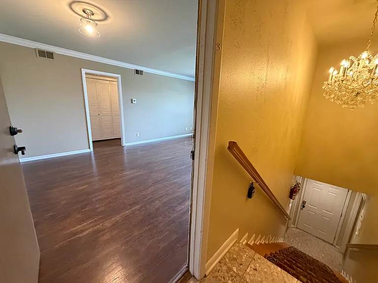 Upstairs entrance to the available Unit