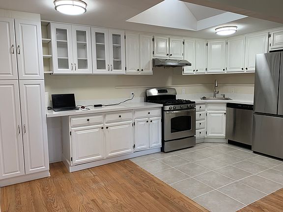 Great kitchen with oak cabinets & skylight