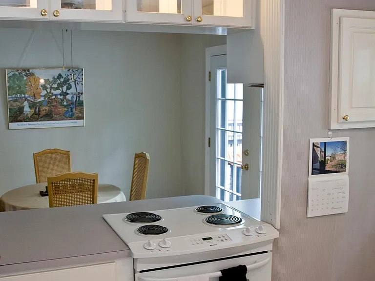 Kitchen opens to dining area that has french doors going to