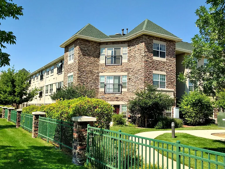 Westerly face of Connections at 6th, pre-renovations. Shows fence around property from 6th Avenue proper, and Juliet balconies.