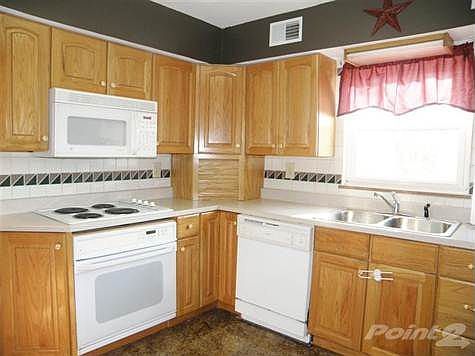 Nicely Updated Kitchen complete with All Appliances * Decorator Tiled Backsplash for Ease of Maintenance!